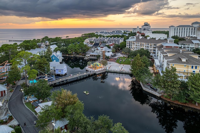 aerial view at dusk with a water view