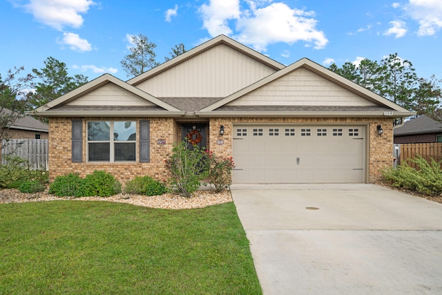 view of front facade featuring a front yard and a garage