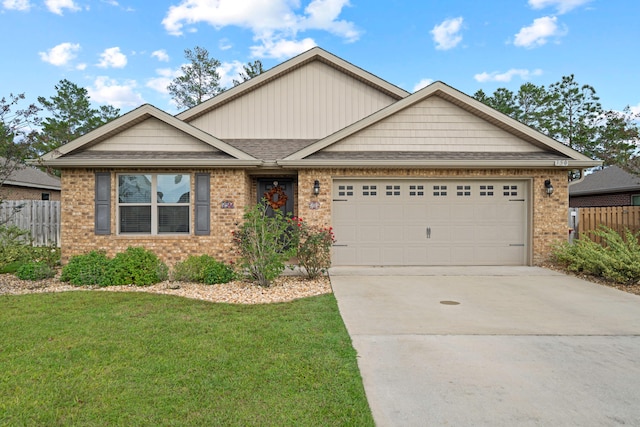 view of front of house featuring a garage and a front yard