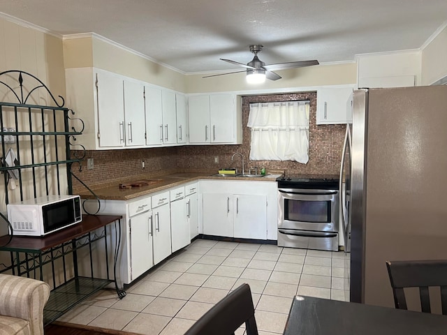 kitchen featuring stainless steel appliances, white cabinetry, ceiling fan, and sink