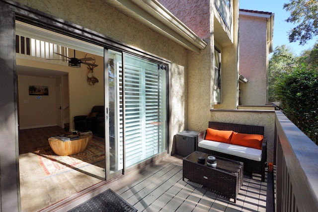 wooden terrace featuring ceiling fan