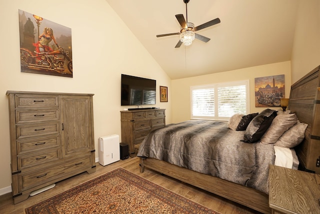 bedroom featuring ceiling fan, high vaulted ceiling, and light hardwood / wood-style floors