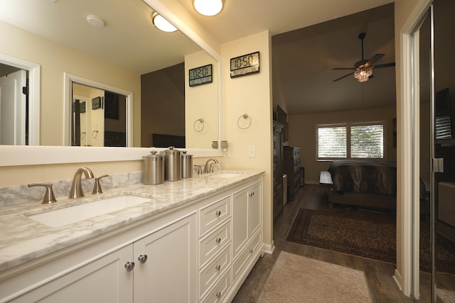 bathroom with vanity, hardwood / wood-style flooring, and ceiling fan