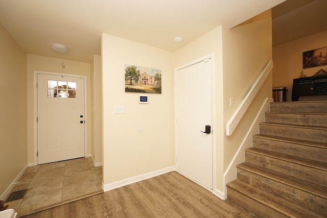 foyer with light wood-type flooring