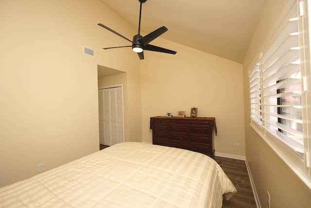 bedroom with dark wood-type flooring, a closet, lofted ceiling, and ceiling fan