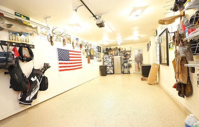 garage featuring refrigerator and a garage door opener