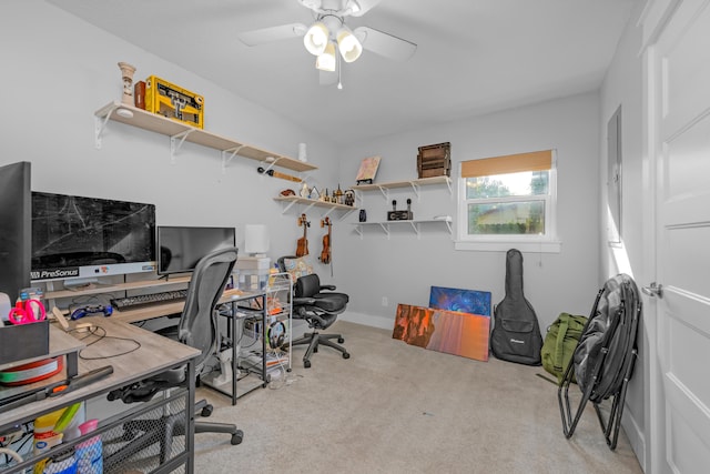 carpeted office space with ceiling fan