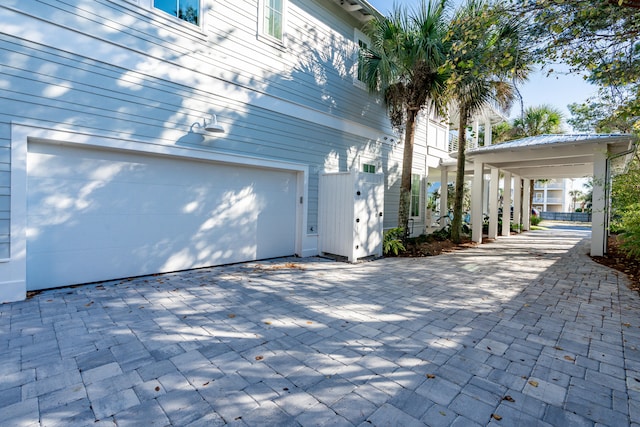 view of side of home with a garage