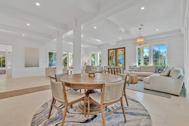 tiled dining space with beam ceiling, a wealth of natural light, and ornamental molding