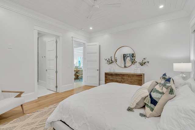 bedroom with wood ceiling, ceiling fan, crown molding, wood-type flooring, and connected bathroom