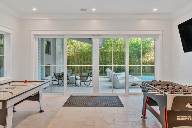 game room with crown molding