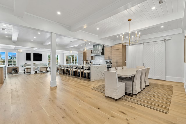 dining space with a notable chandelier, beam ceiling, and light wood-type flooring