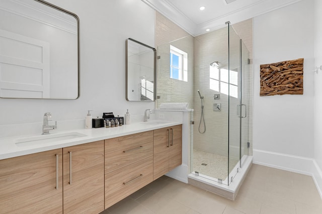 bathroom featuring vanity, tile patterned floors, a shower with door, and crown molding