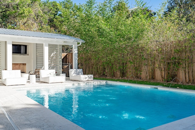 view of swimming pool with an outdoor living space