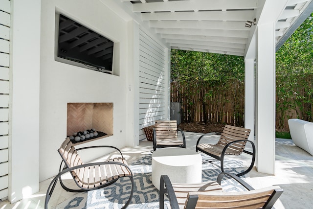 view of patio / terrace featuring exterior fireplace