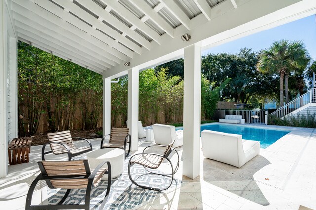 view of patio / terrace with a fenced in pool