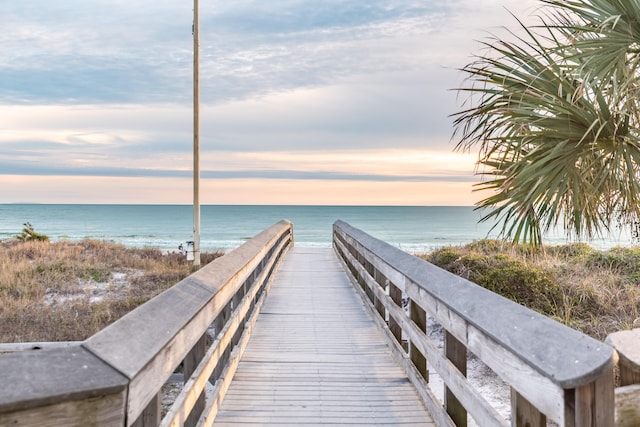 view of property's community featuring a view of the beach and a water view