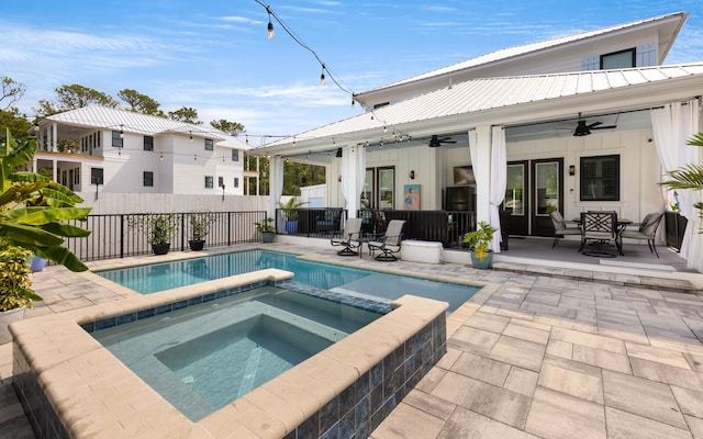 view of pool featuring ceiling fan, a patio, and an in ground hot tub