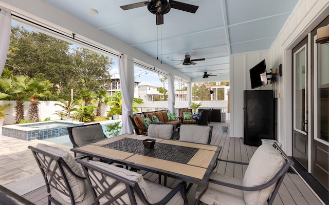 exterior space with ceiling fan