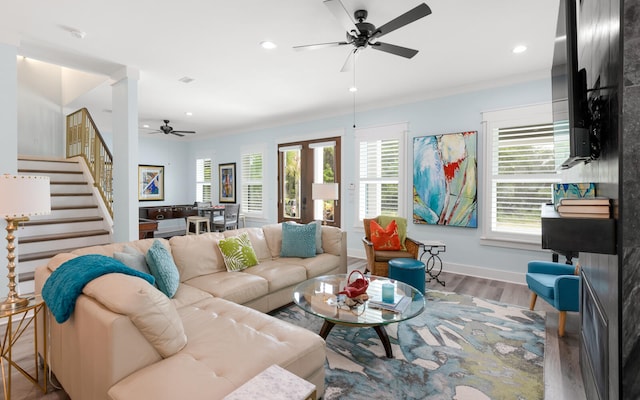 living room with ceiling fan and hardwood / wood-style floors