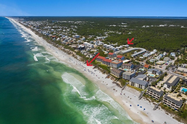 bird's eye view featuring a view of the beach and a water view