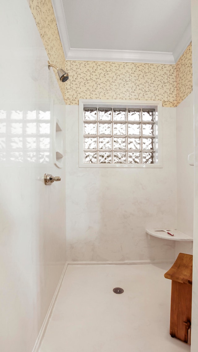 bathroom featuring crown molding, a shower, and a healthy amount of sunlight