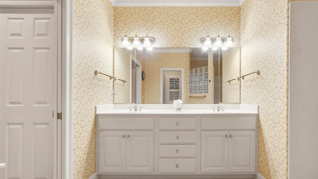 bathroom featuring crown molding and vanity