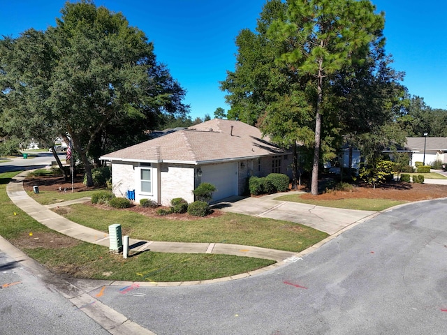 view of property exterior with a yard and a garage