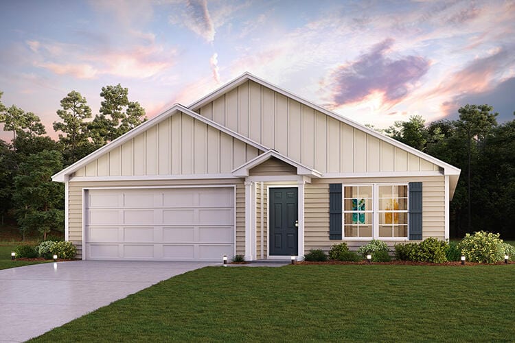 view of front of home with a yard and a garage