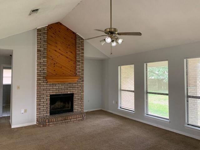 unfurnished living room featuring a brick fireplace, ceiling fan, carpet flooring, and vaulted ceiling