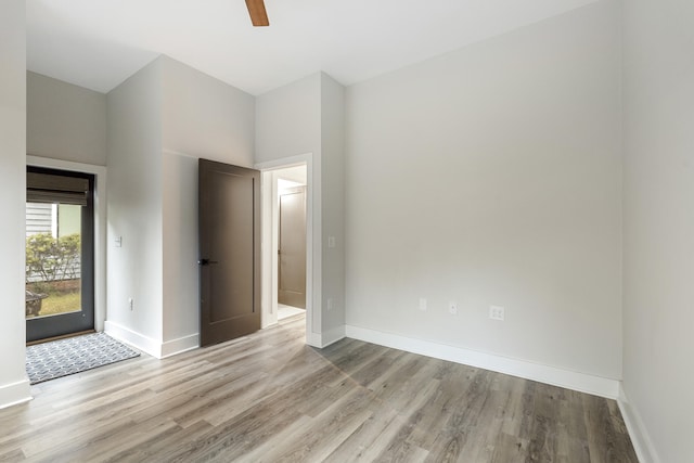 empty room featuring ceiling fan and light hardwood / wood-style floors