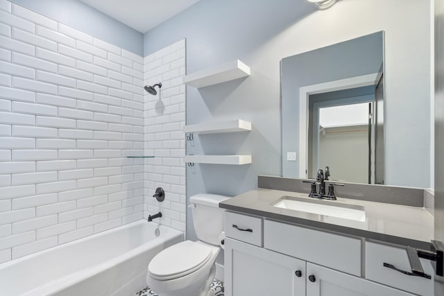 full bathroom with vanity, toilet, and tiled shower / bath