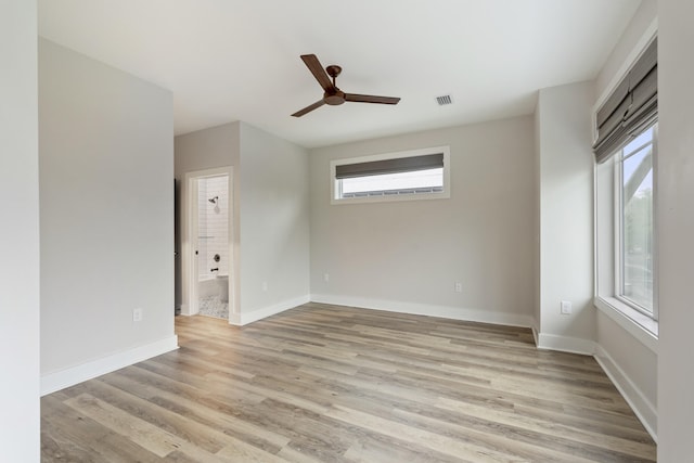 unfurnished room with ceiling fan and light hardwood / wood-style flooring