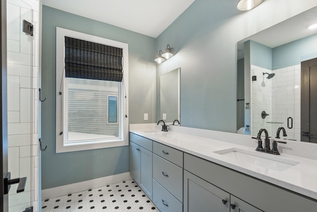 bathroom with tile patterned floors, vanity, and an enclosed shower