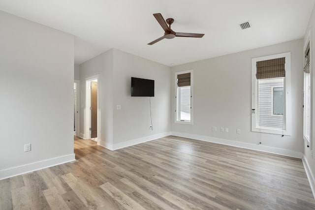 empty room with light hardwood / wood-style flooring and ceiling fan