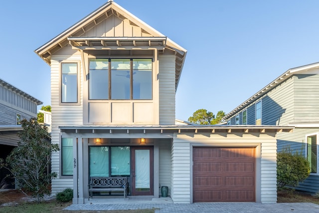 277 Edens Landing Cir, Santa Rosa Beach, FL 32459 - view of front of house with an attached garage and board and batten siding