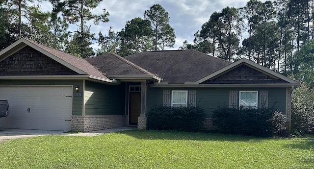 view of front facade featuring a front yard and a garage