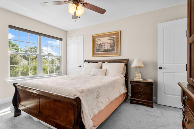 carpeted bedroom with ceiling fan