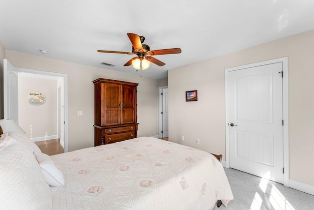 carpeted bedroom featuring ceiling fan