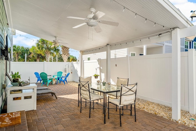 view of patio / terrace featuring ceiling fan