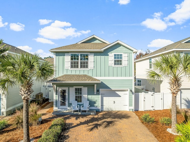 135 Grayling Way, Inlet Beach, FL 32461 - view of front of house with a gate, board and batten siding, a garage, decorative driveway, and a shingled roof