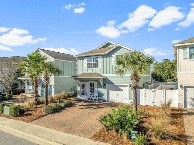 135 Grayling Way, Inlet Beach, FL 32461 - view of front of property featuring a gate, a garage, board and batten siding, and decorative driveway