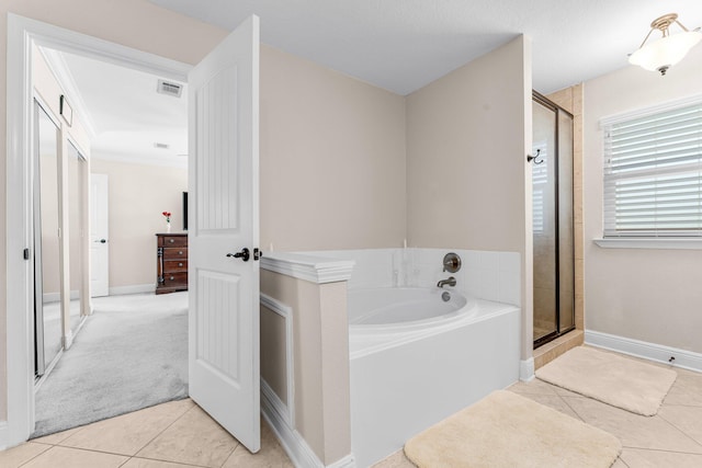 bathroom featuring tile patterned flooring, crown molding, and independent shower and bath