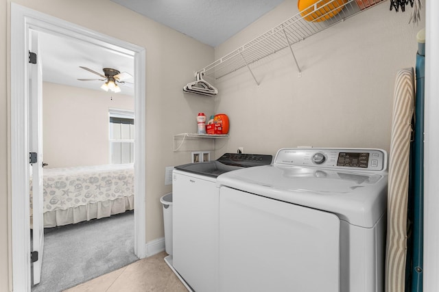 135 Grayling Way, Inlet Beach, FL 32461 - laundry area featuring independent washer and dryer, a ceiling fan, light carpet, light tile patterned flooring, and baseboards