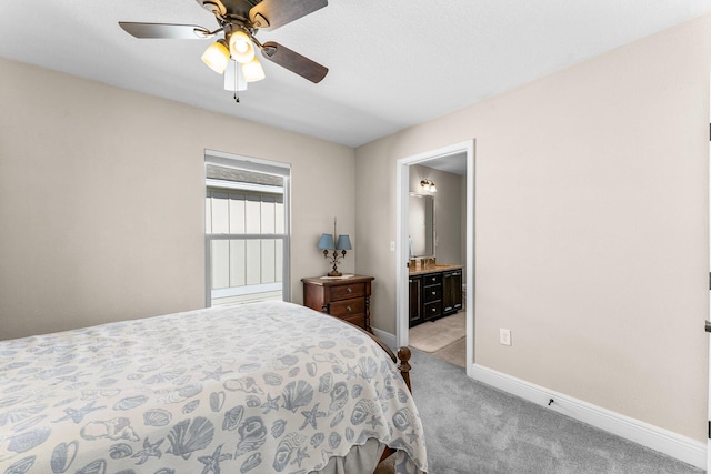 carpeted bedroom featuring ceiling fan and connected bathroom