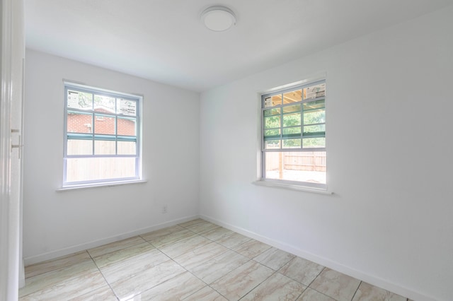 spare room featuring plenty of natural light