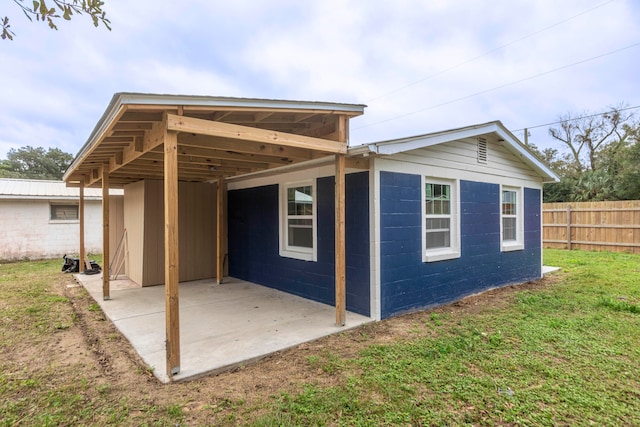 view of outbuilding with a lawn