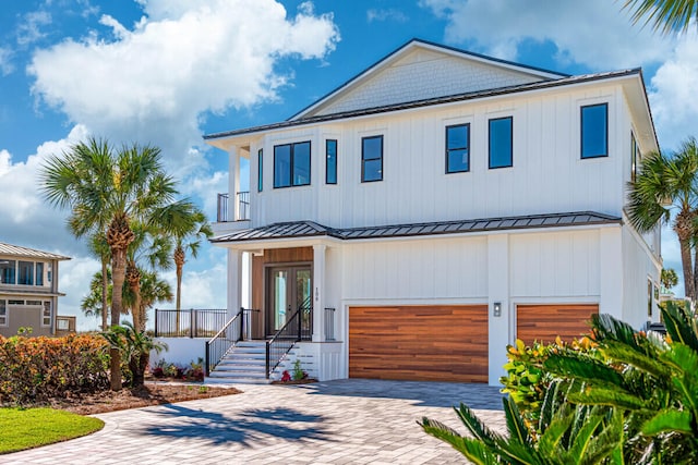 view of front of house featuring a garage and french doors