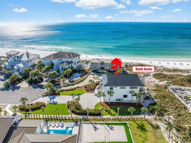 bird's eye view with a view of the beach and a water view