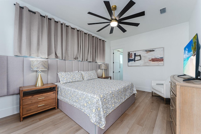 bedroom featuring light wood-type flooring and ceiling fan